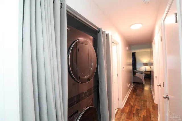 a view of a hallway with a washer and dryer