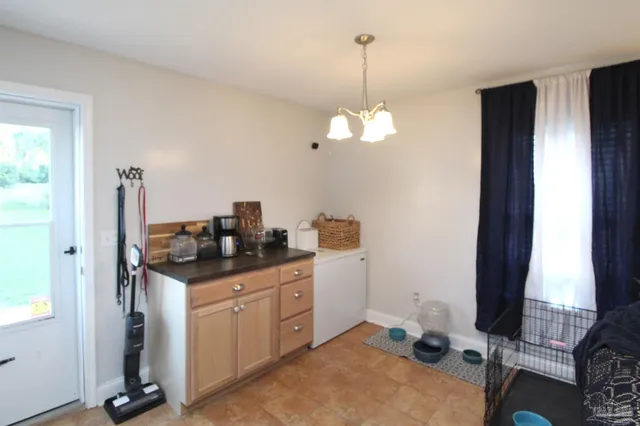a kitchen with stainless steel appliances granite countertop a stove and a sink