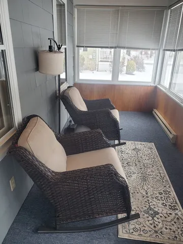 a living room with furniture and a window