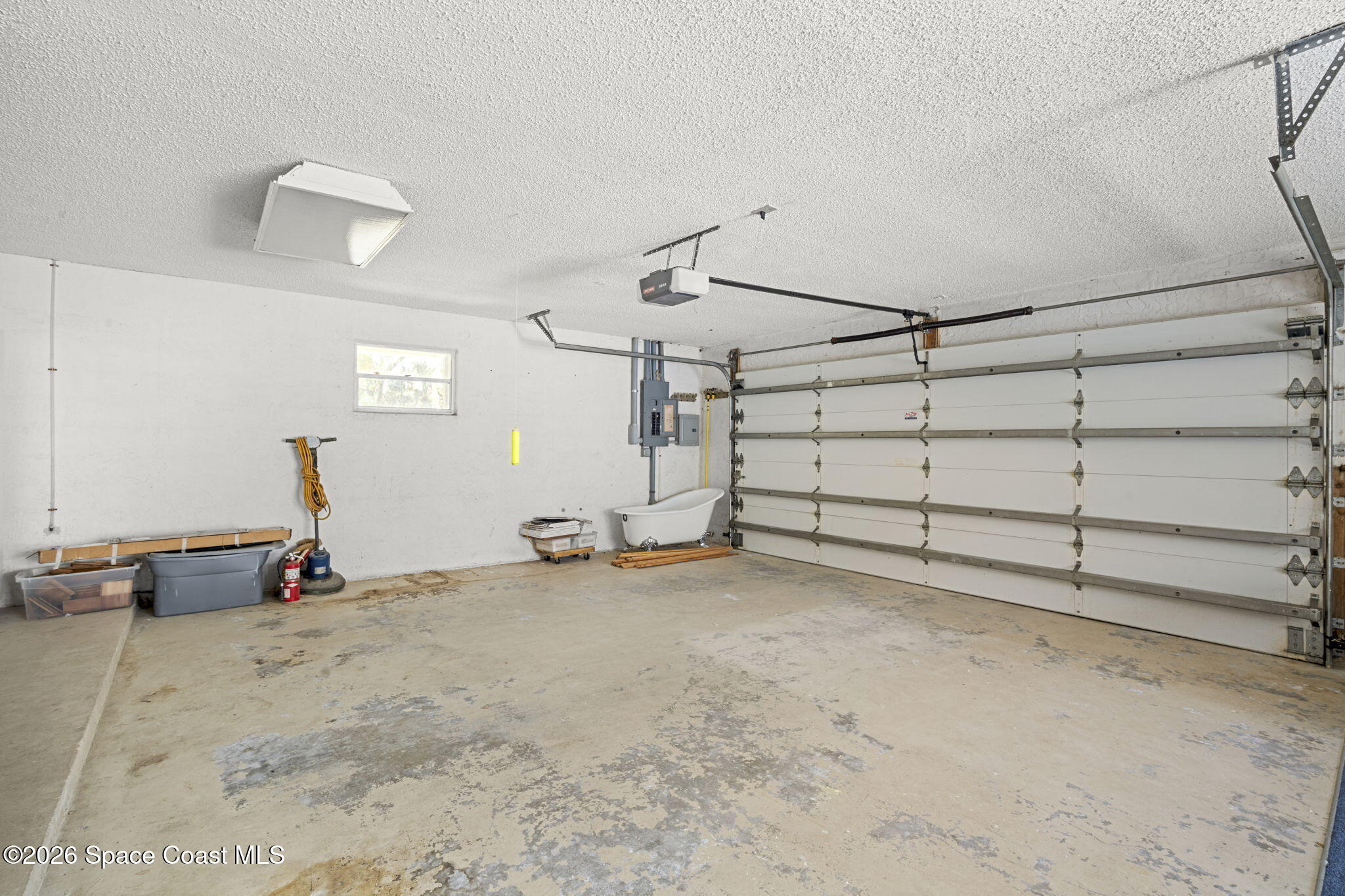 620 West Pine Road Melbourne, FL 32904 - Photo 26 of 32 a view of a garage with furniture