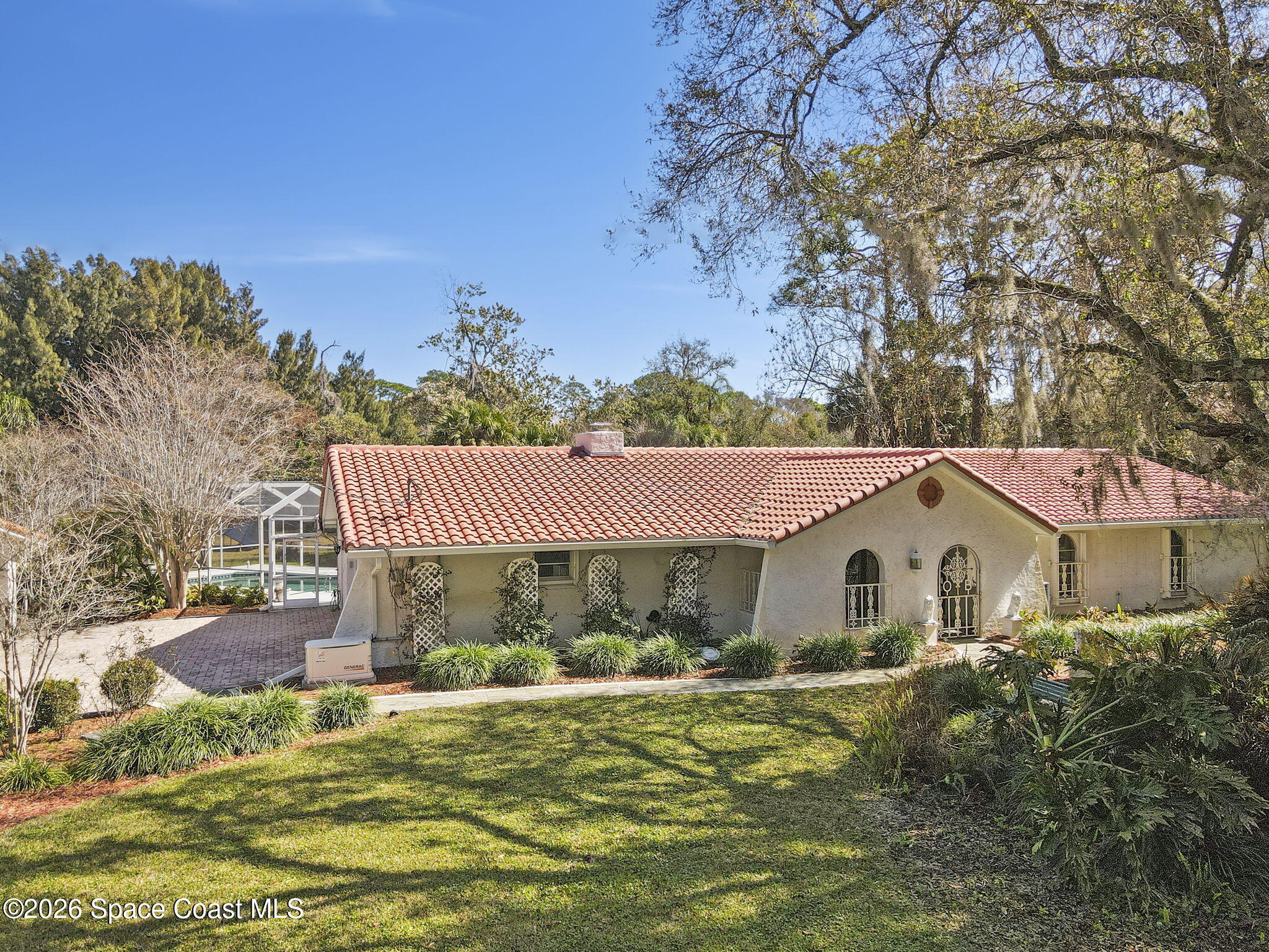 620 West Pine Road Melbourne, FL 32904 - Photo 3 of 32 a view of house with garden space and sitting area