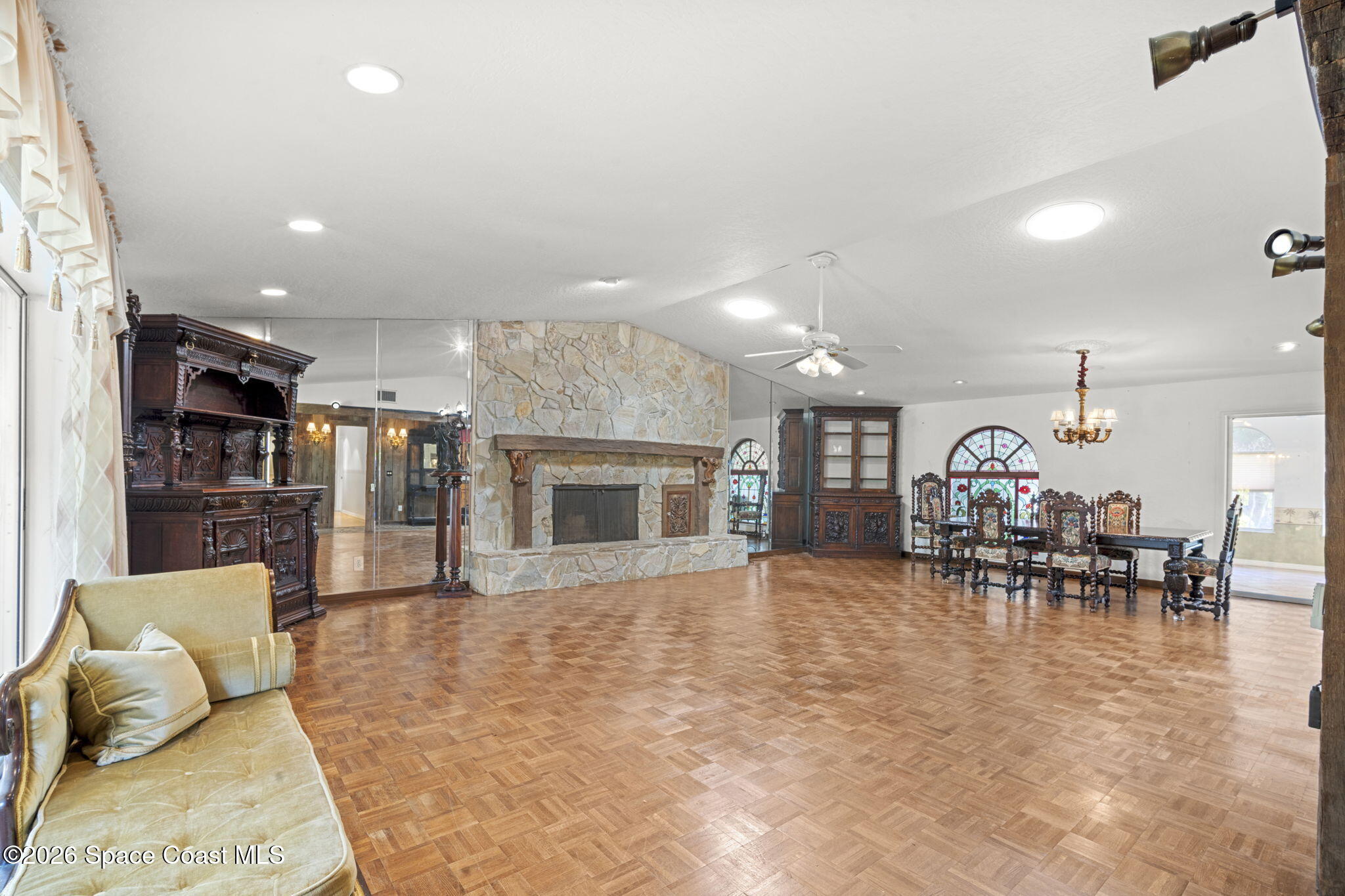 620 West Pine Road Melbourne, FL 32904 - Photo 9 of 32 a living room with furniture and a fireplace