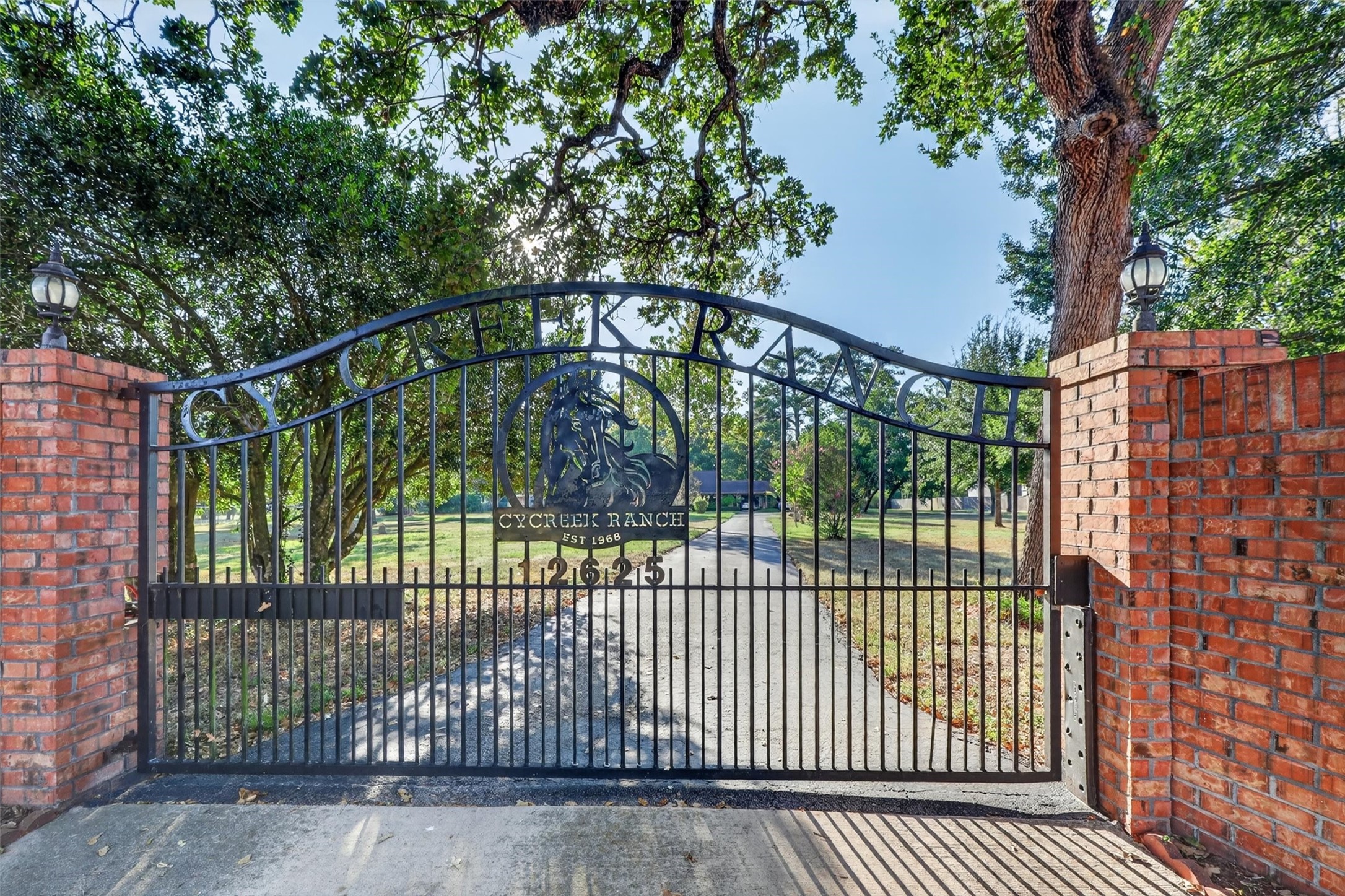 Envision passing through these beautiful wrought-iron gates, leaving the hustle and bustle behind as you travel down a peaceful, tree-lined driveway. Established in 1968, Cy Creek Ranch welcomes you to a world of privacy, natural beauty, and timeless Texas charm. Beyond these gates lies more than a home—it's a place where dreams take shape, memories are made, and a legacy can be passed down for generations. Your private Texas retreat awaits!