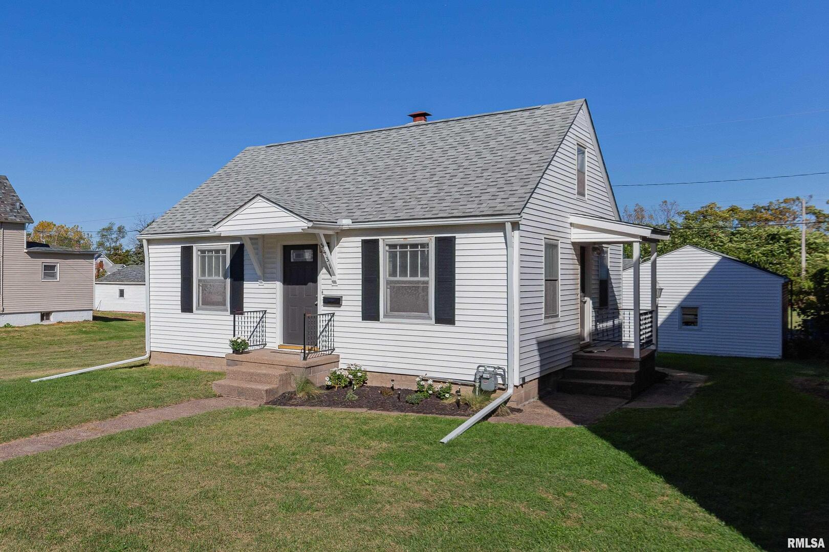 a house with garden in front of it
