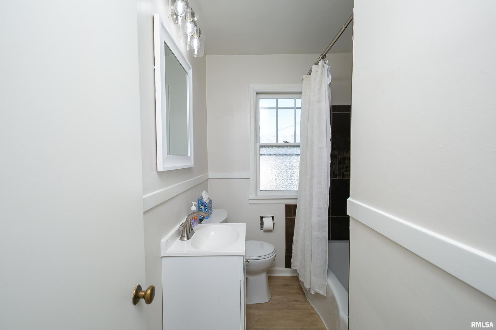 5431 3rd Avenue Moline, IL 61265 - Photo 17 of 29 a bathroom with a sink toilet and window