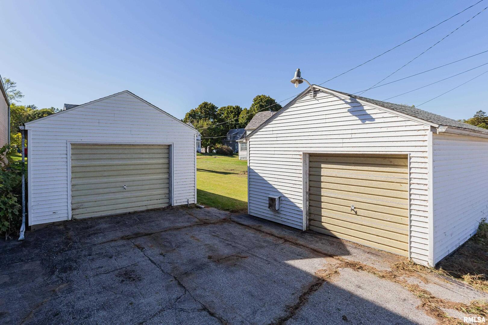 5431 3rd Avenue Moline, IL 61265 - Photo 22 of 29 a view of a house with a yard and garage