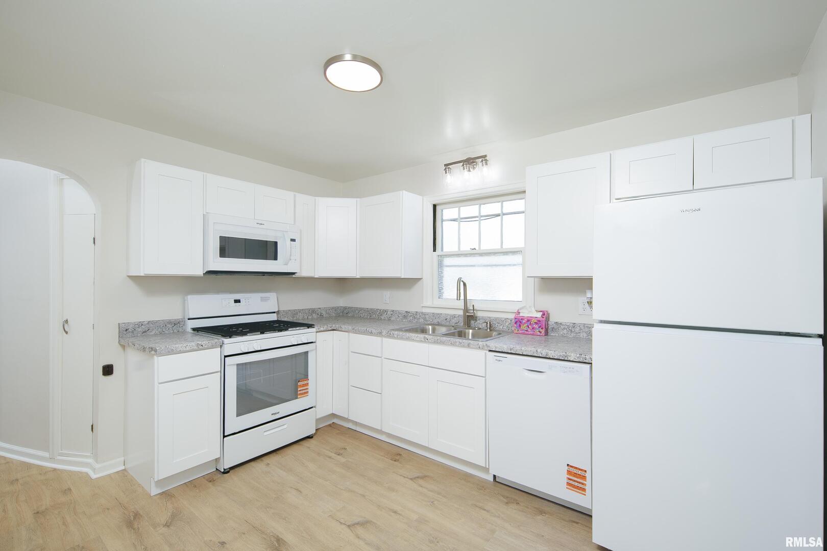 5431 3rd Avenue Moline, IL 61265 - Photo 3 of 29 a kitchen with stainless steel appliances granite countertop a stove a sink and a refrigerator