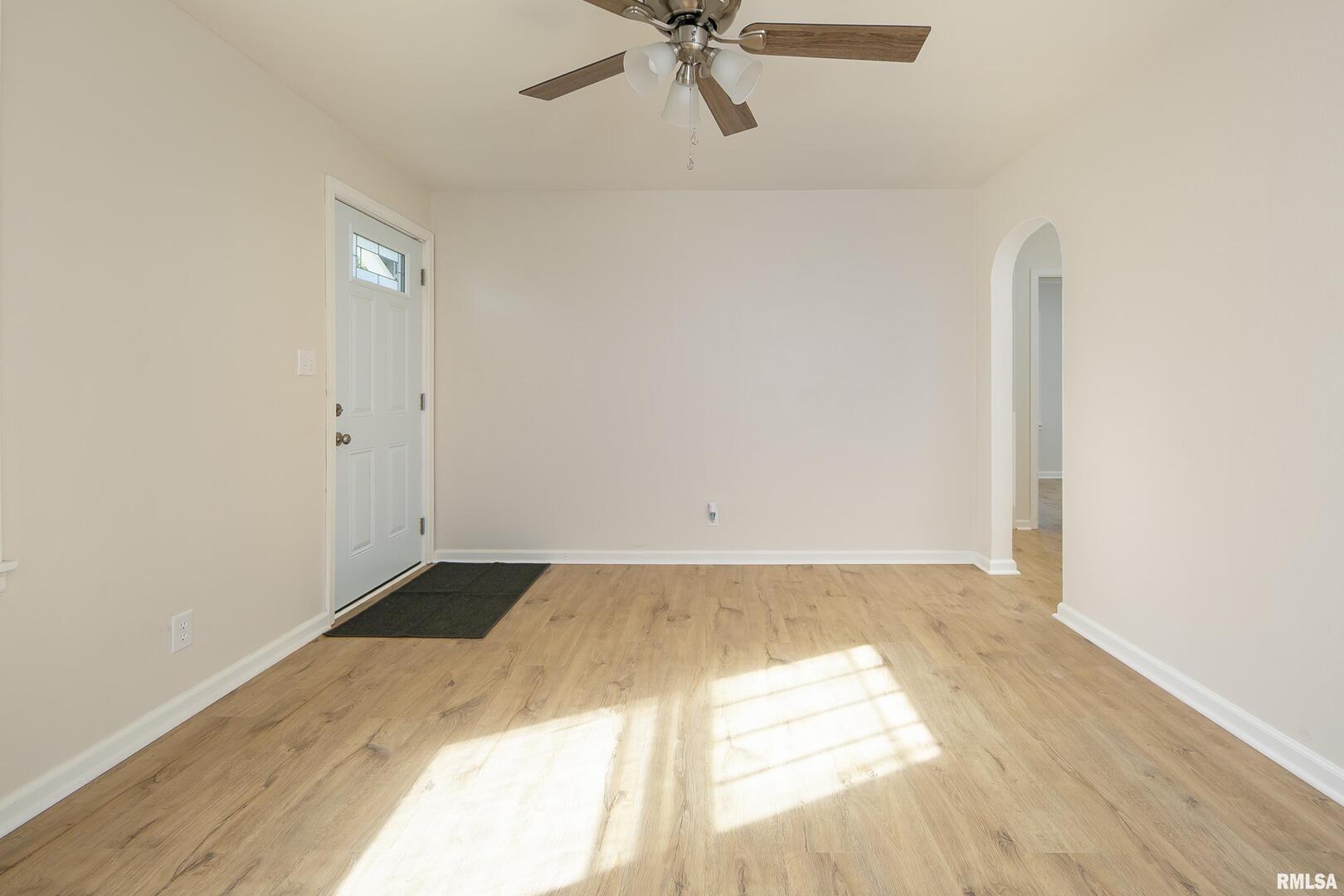 5431 3rd Avenue Moline, IL 61265 - Photo 9 of 29 a view of a room with wooden floor and a ceiling fan