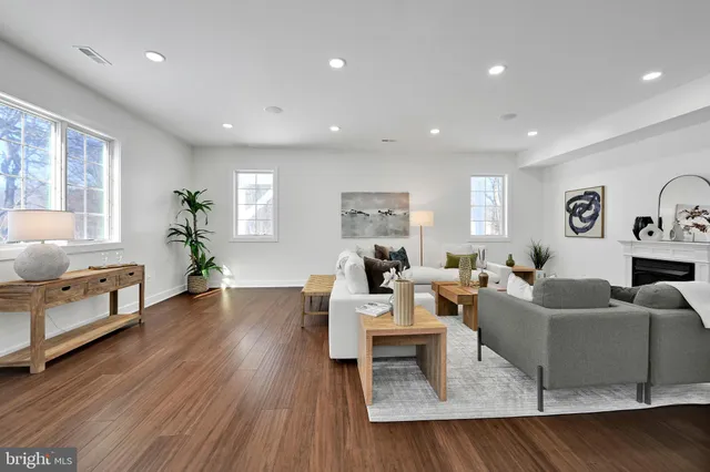 a view of a room with wooden floor and window