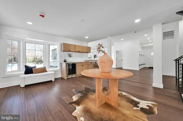 a view of a hall with wooden floor