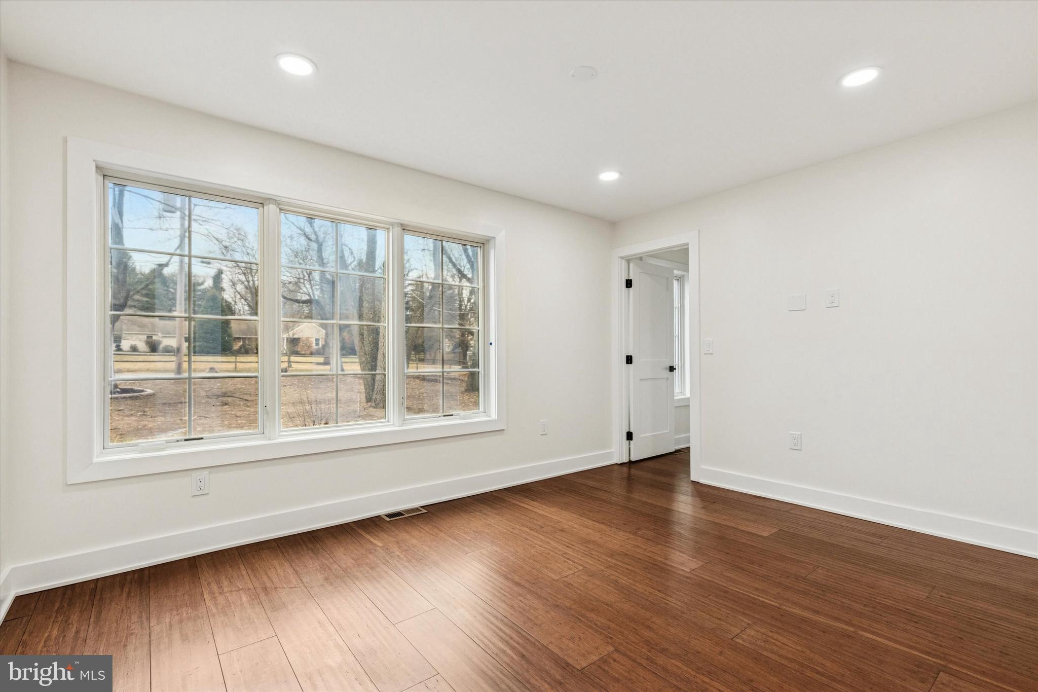 780 Hobbs Road Wayne, PA 19087 - Photo 65 of 94 a view of empty room with wooden floor and fan