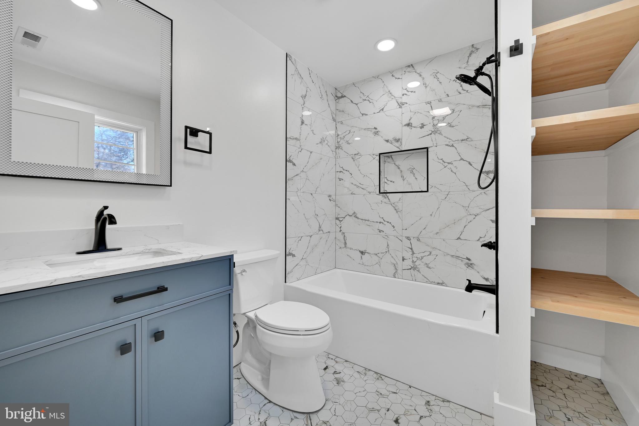 780 Hobbs Road Wayne, PA 19087 - Photo 66 of 94 a bathroom with a bathtub shower sink mirror and toilet