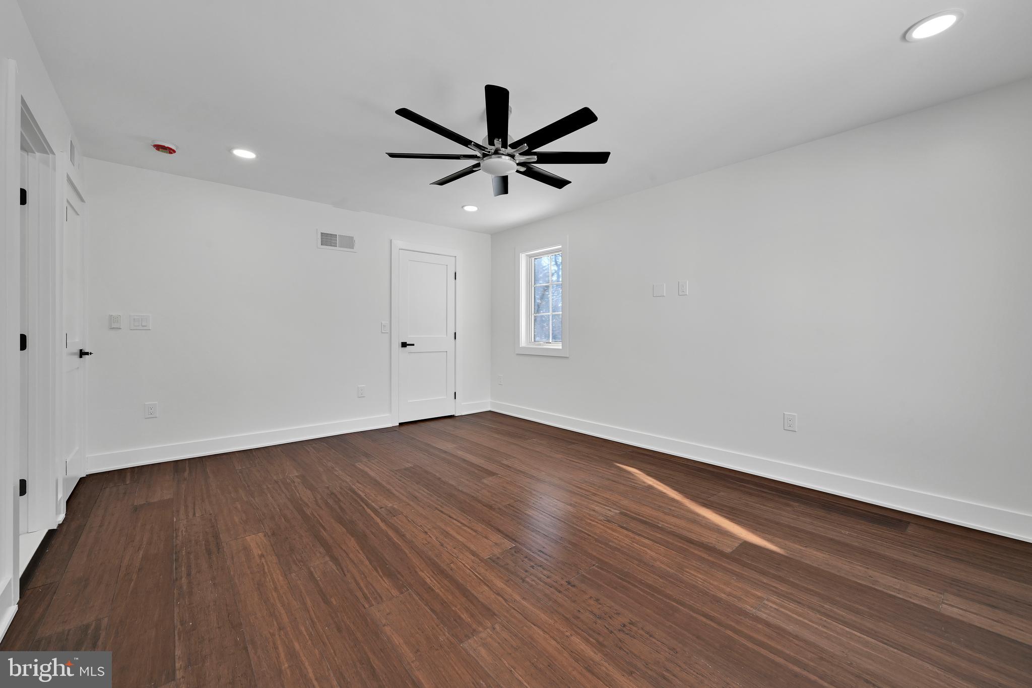 780 Hobbs Road Wayne, PA 19087 - Photo 74 of 94 an empty room with wooden floor a ceiling fan and fan