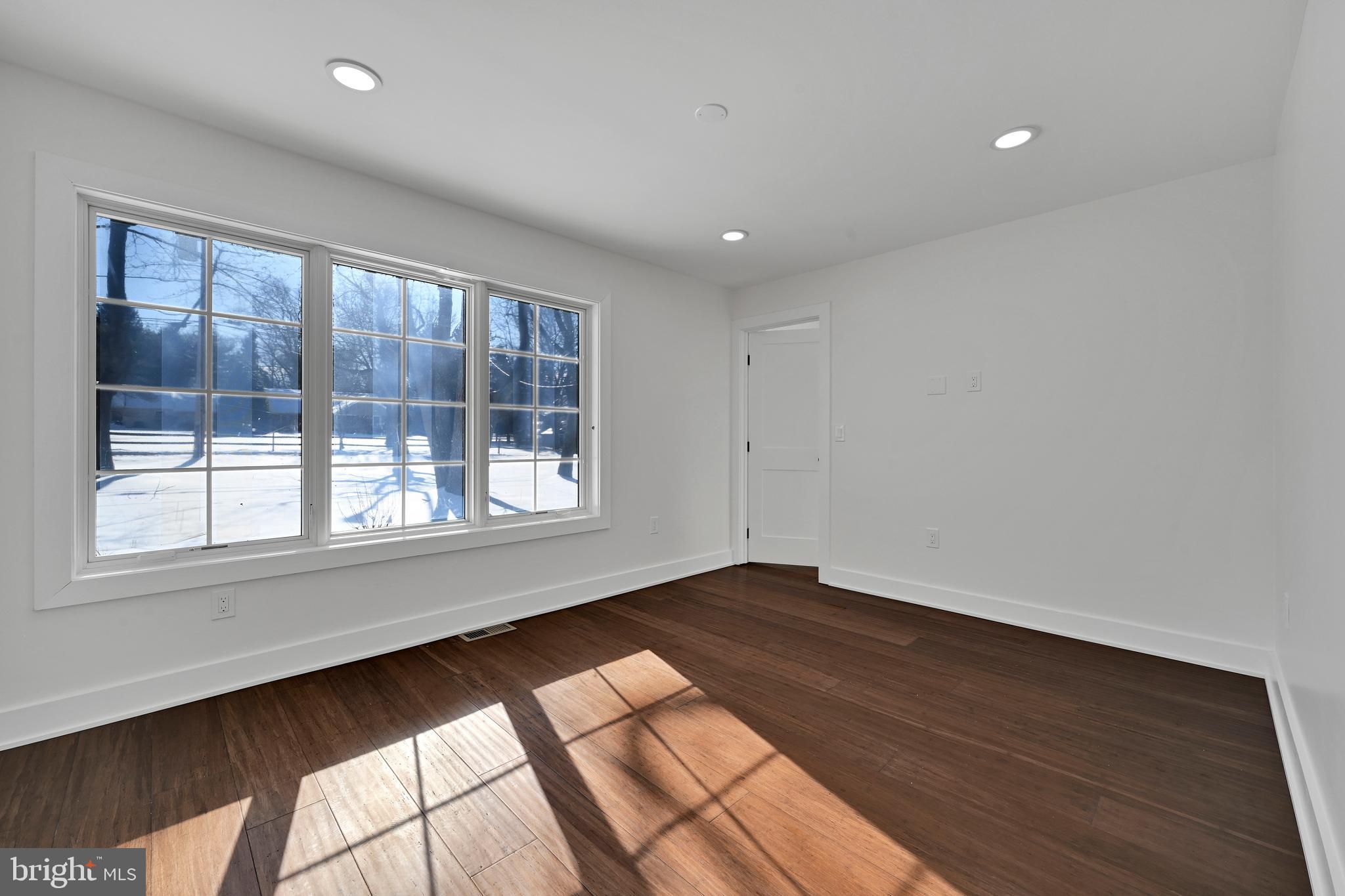 780 Hobbs Road Wayne, PA 19087 - Photo 78 of 94 a view of an empty room with wooden floor and a window