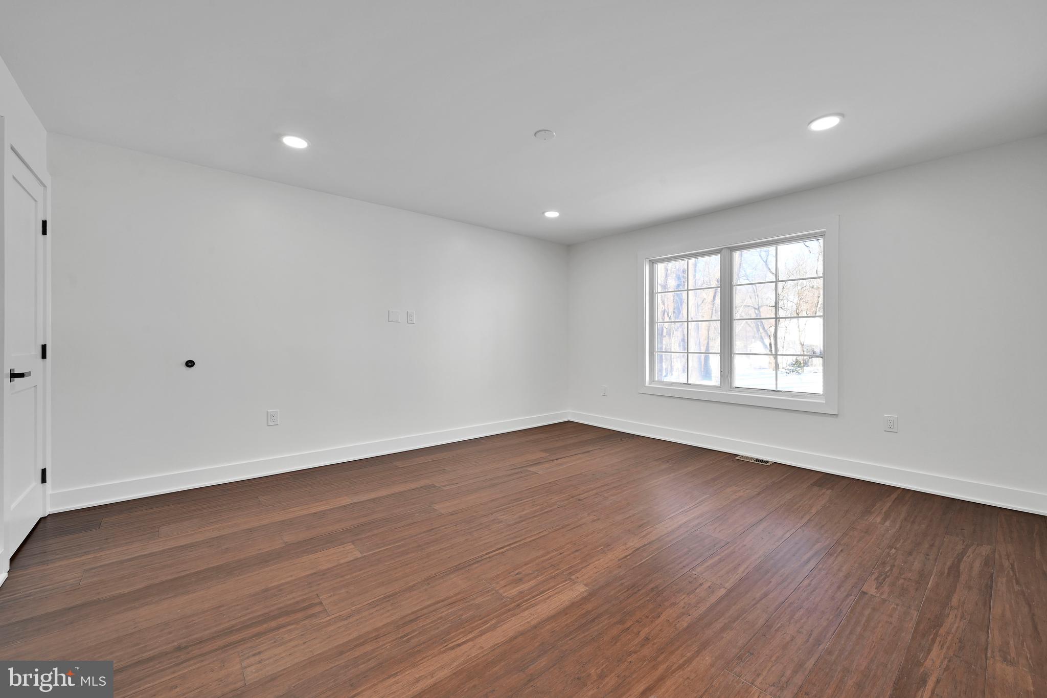 780 Hobbs Road Wayne, PA 19087 - Photo 80 of 94 a view of an empty room with wooden floor and window