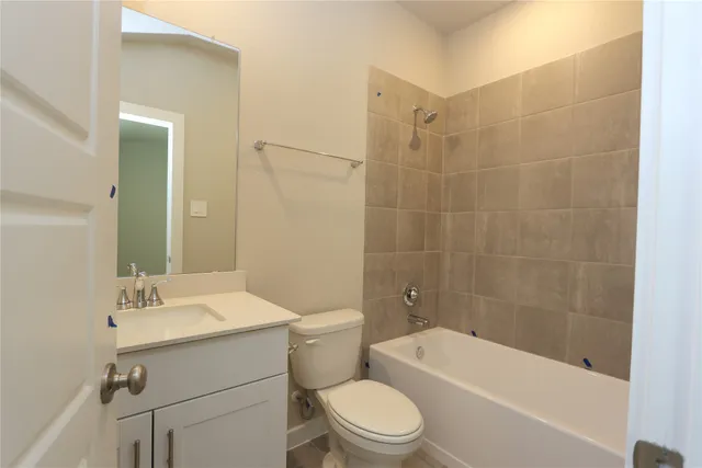 a bathroom with a toilet a sink and bathtub