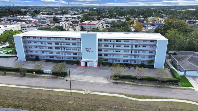 a view of a building with a yard
