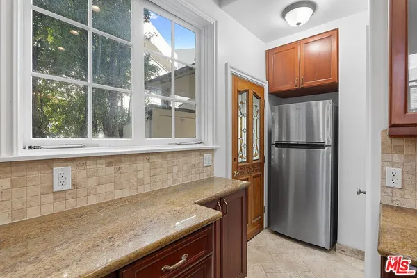 a bathroom with a sink a mirror and a shower