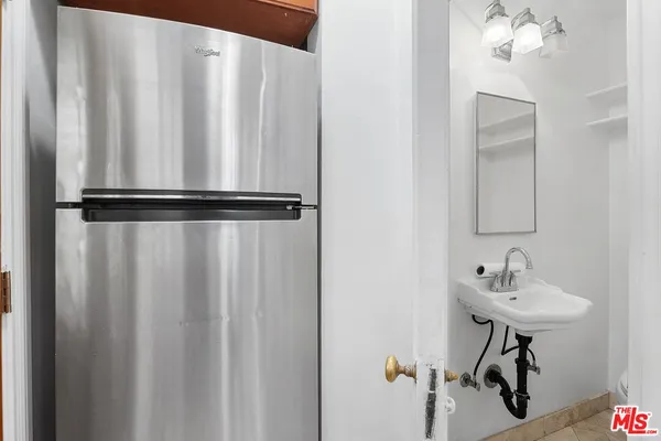 a view of a storage & utility room with a washer dryer