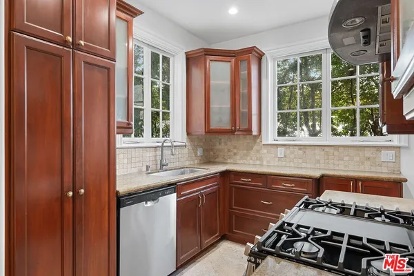 a kitchen with a sink and a window