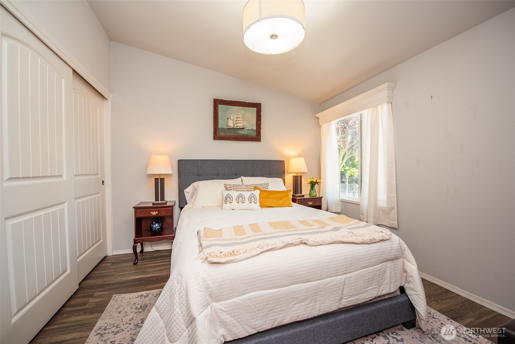 720 West Heritage Loop Sequim, WA 98382 - Photo 24 of 35 a bedroom with a bed and a window