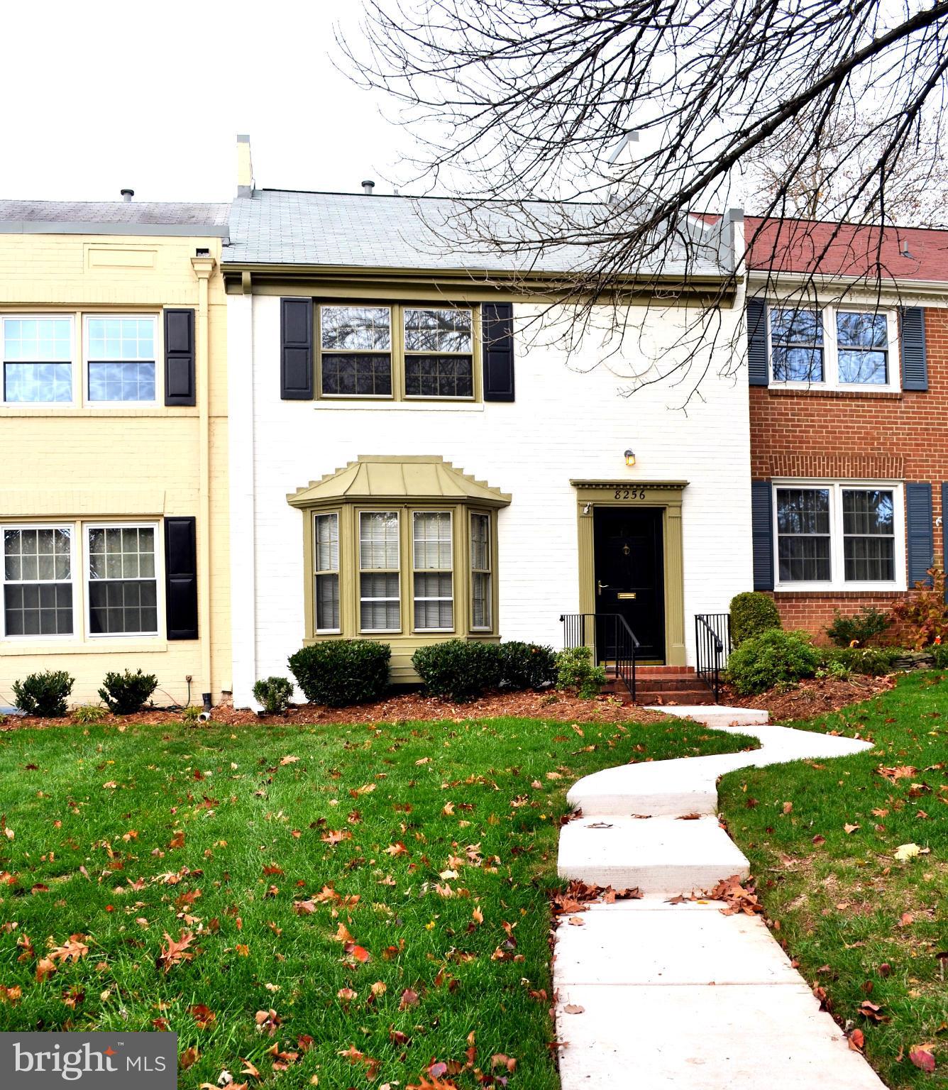 a front view of a building with garden