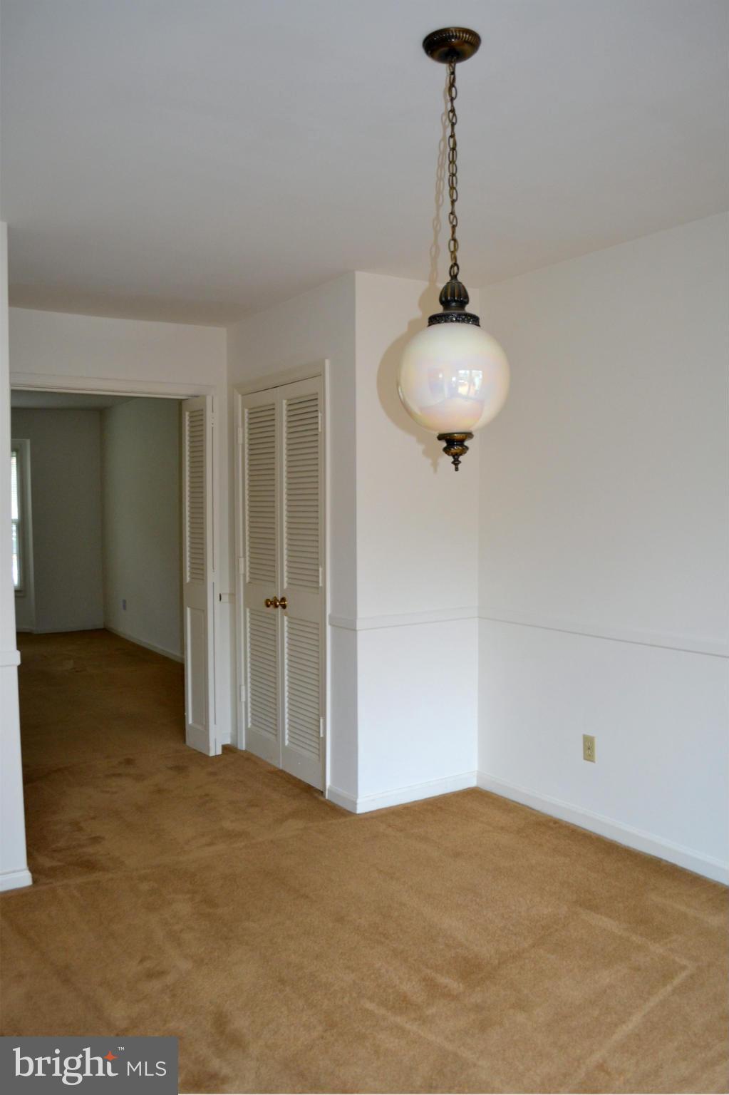 8256 Carrleigh Parkway Springfield, VA 22152 - Photo 11 of 28 a view of a livingroom and a chandelier