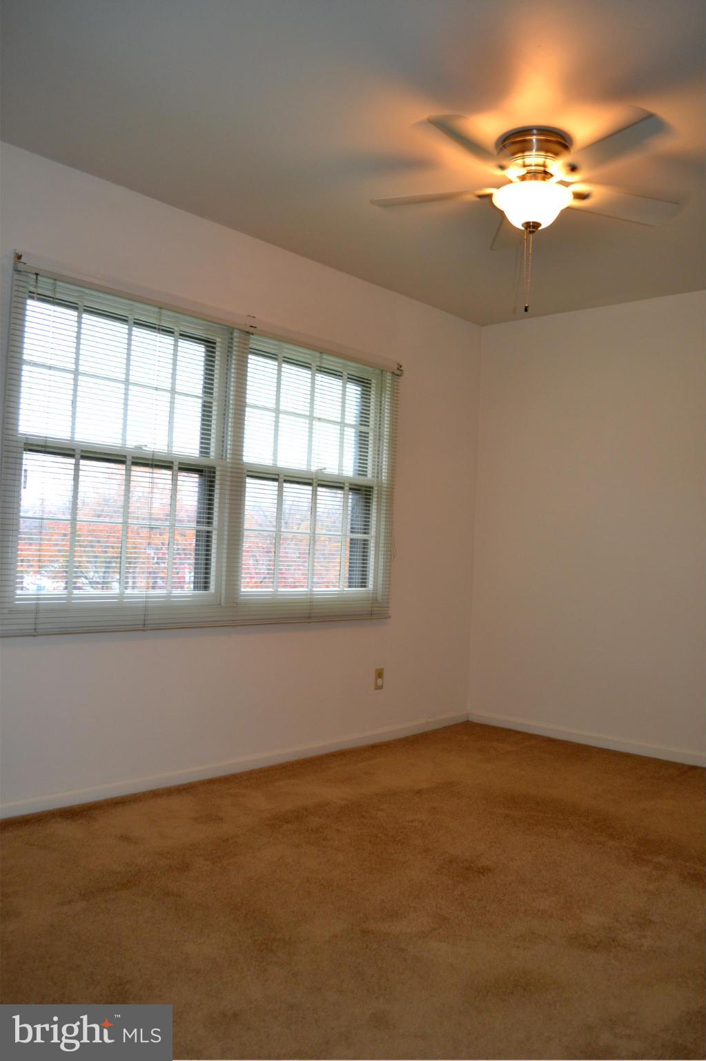 8256 Carrleigh Parkway Springfield, VA 22152 - Photo 14 of 28 a view of an empty room with a window