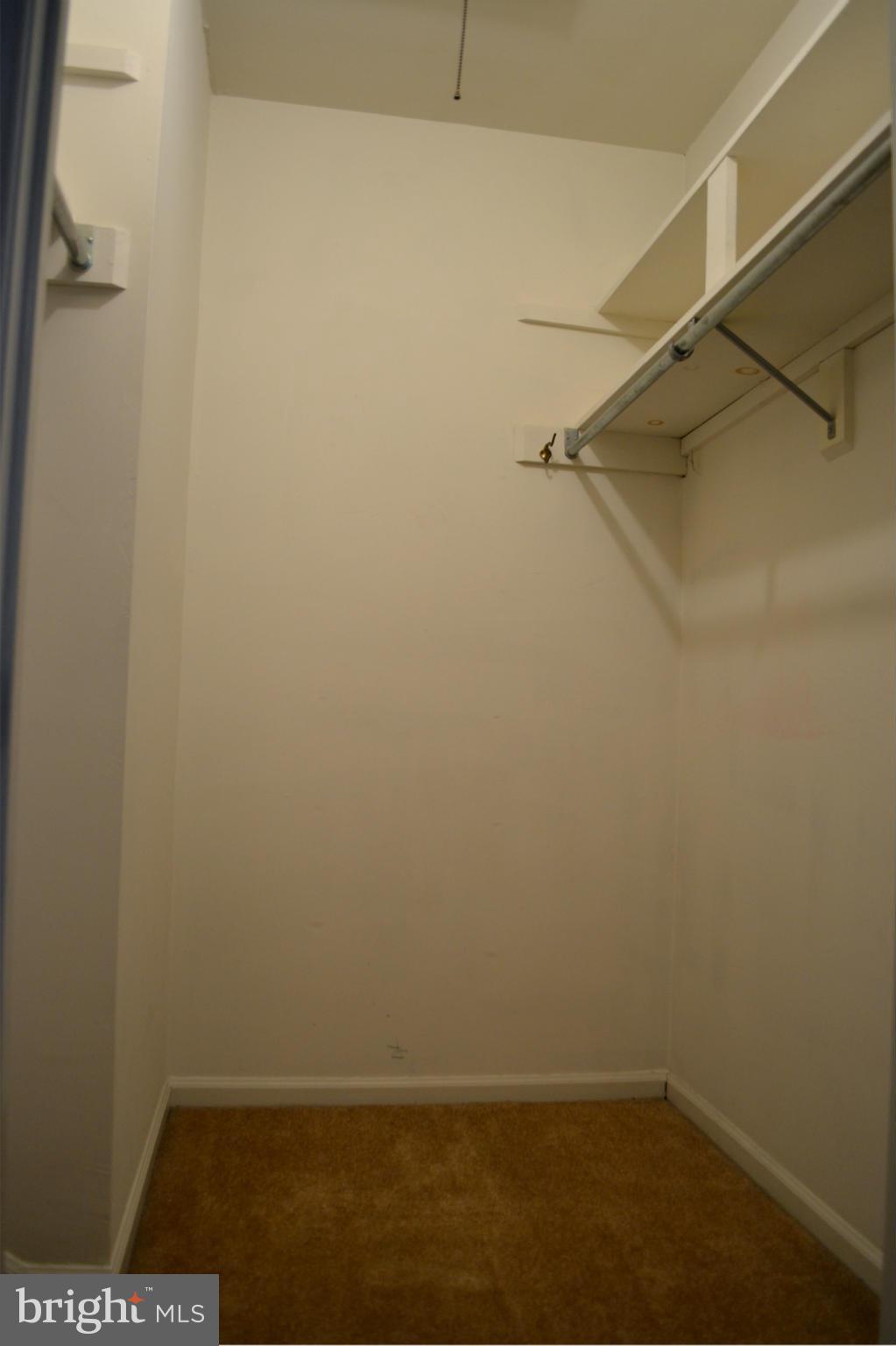 8256 Carrleigh Parkway Springfield, VA 22152 - Photo 15 of 28 a view of small space with racks on the wall