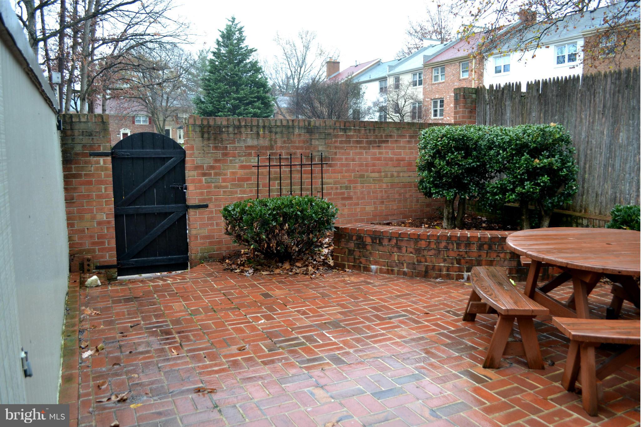 8256 Carrleigh Parkway Springfield, VA 22152 - Photo 2 of 28 a view of backyard with outdoor seating and plants