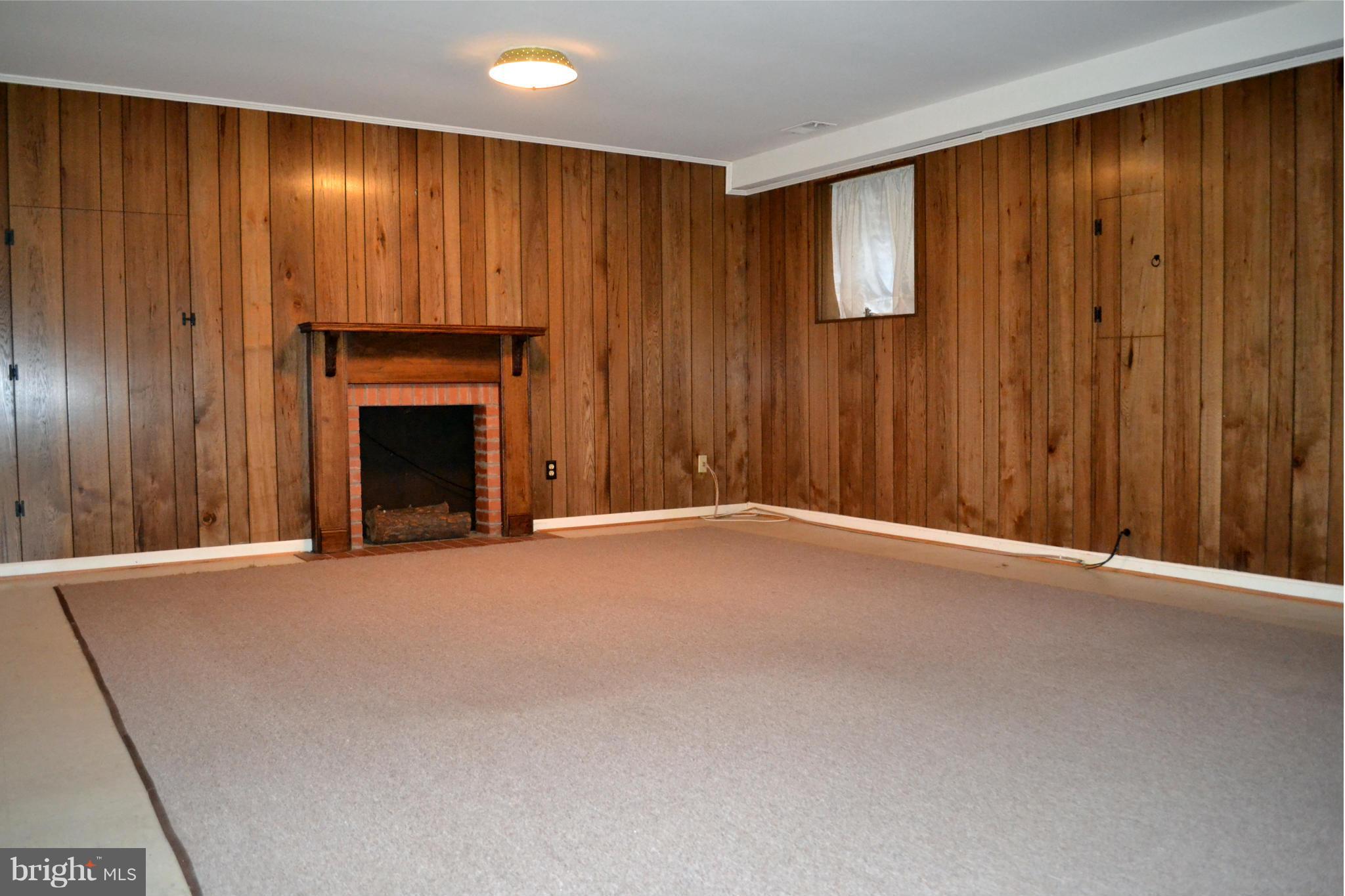 8256 Carrleigh Parkway Springfield, VA 22152 - Photo 28 of 28 an empty room with a fireplace