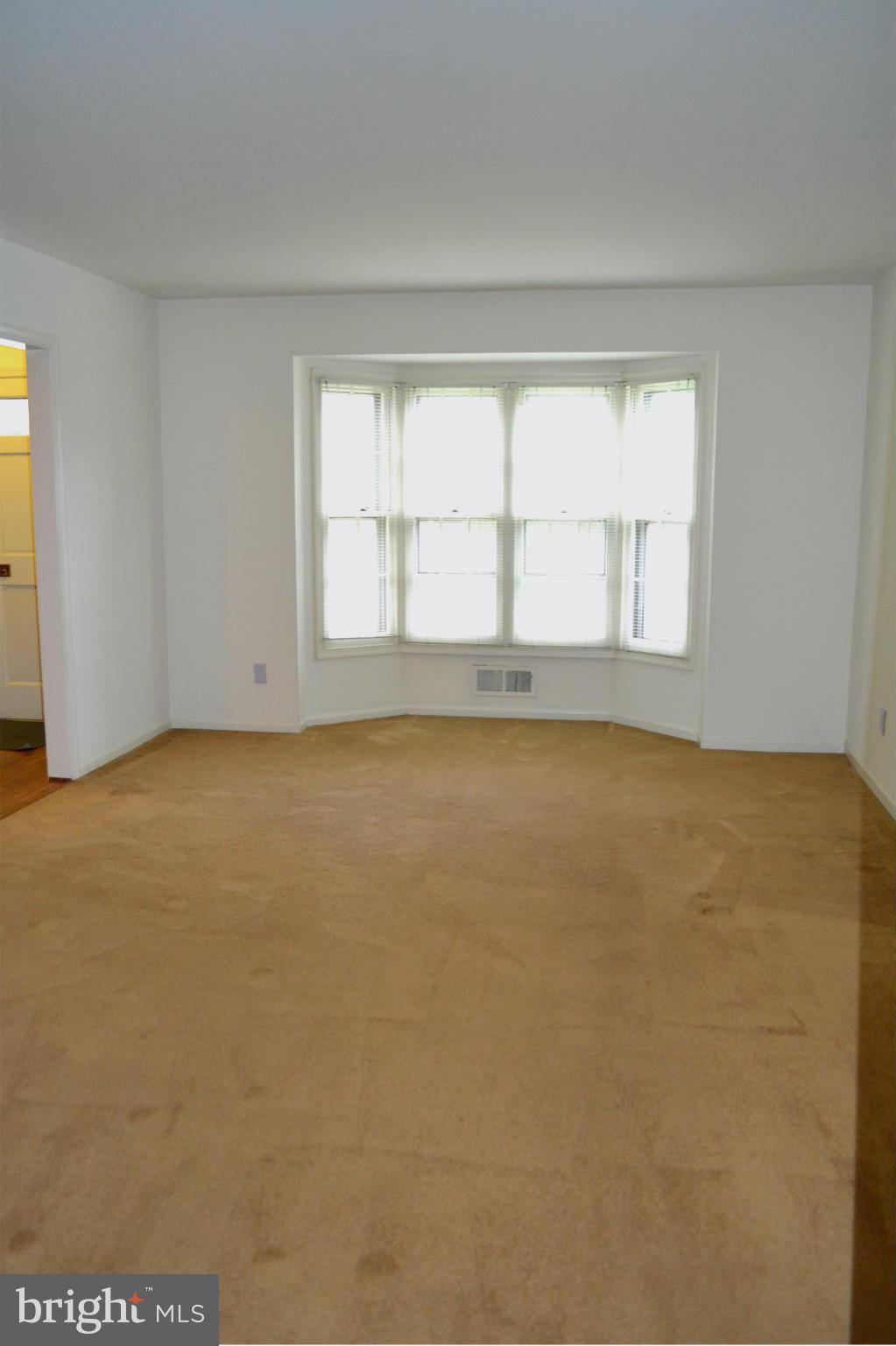 8256 Carrleigh Parkway Springfield, VA 22152 - Photo 5 of 28 an empty room with a empty space and a window