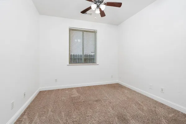 an empty room with fan