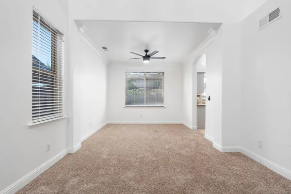 a view of a hallway with windows