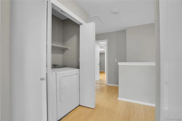 a view of storage and utility room with closet