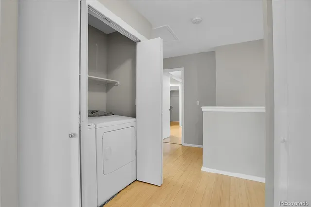 a view of storage and utility room with closet