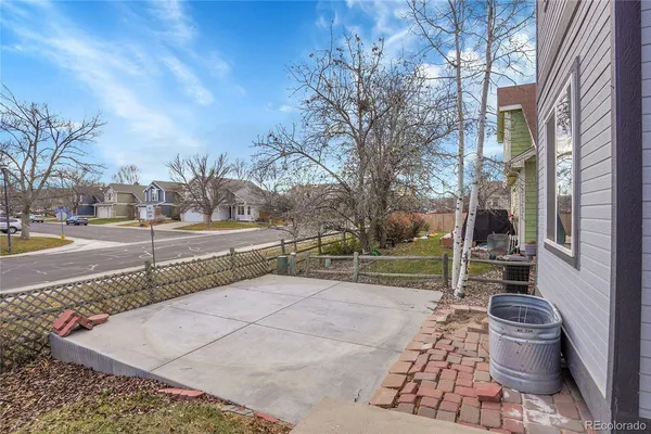 a view of a patio with a table and chairs