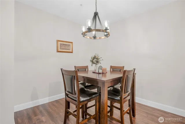 a dining room with a table and chairs