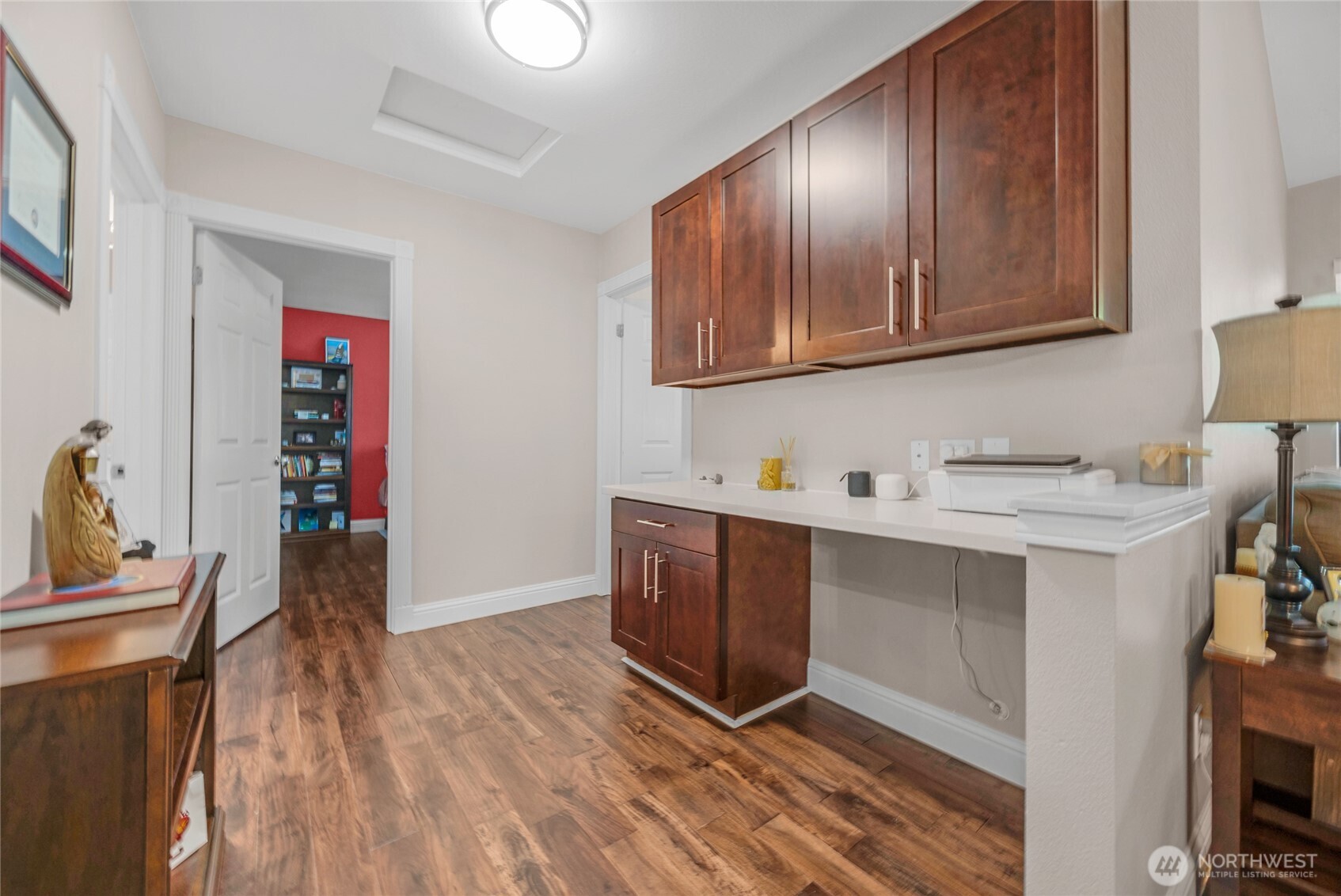 15300 112th Avenue Northeast, Unit A304 Bothell, WA 98011 - Photo 14 of 28 a view of cabinets with wooden floor and electronic appliances