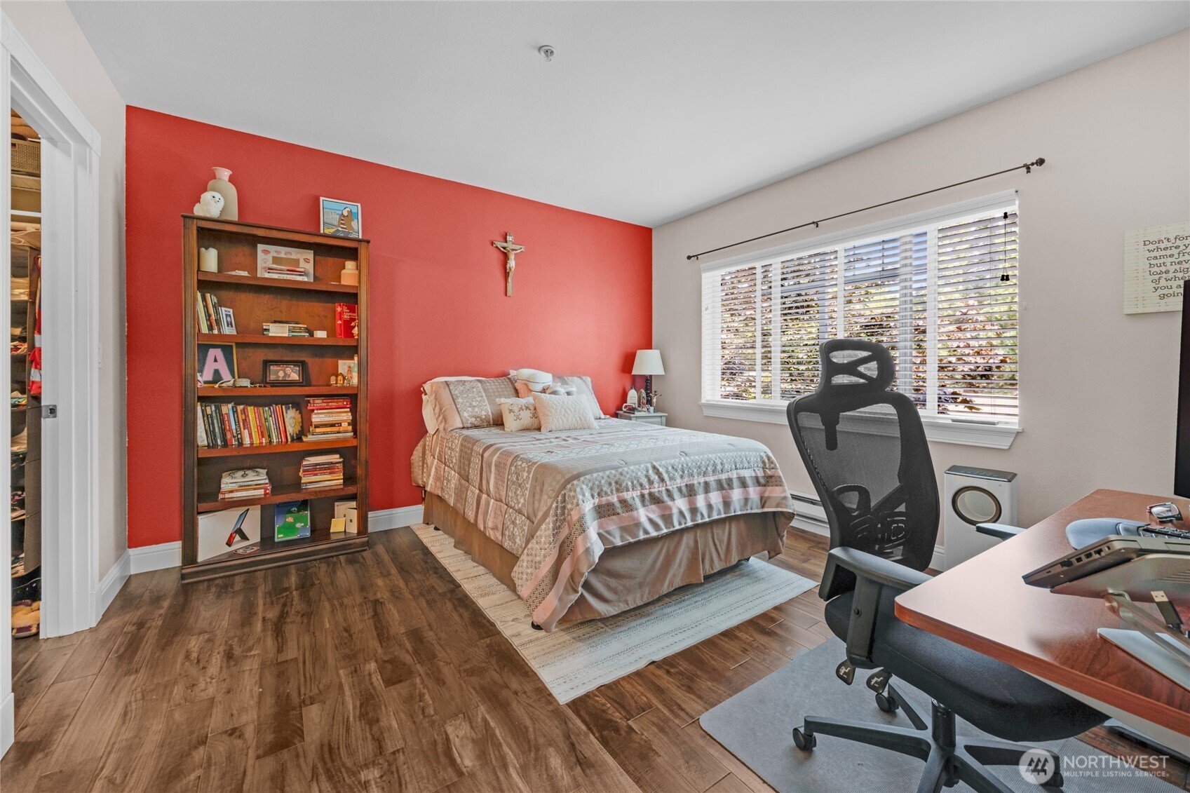 15300 112th Avenue Northeast, Unit A304 Bothell, WA 98011 - Photo 15 of 28 a bedroom with a bed a desk and chair with the wooden floor