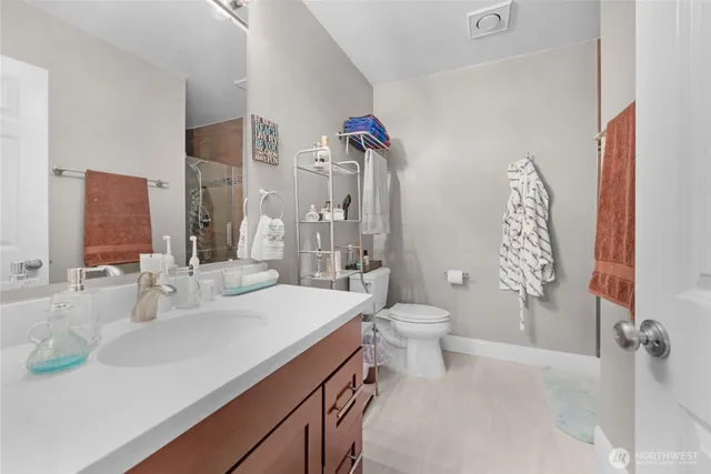 a bathroom with a sink toilet and shower