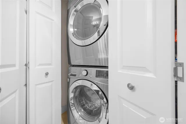 a close view of utility room with washer and dryer