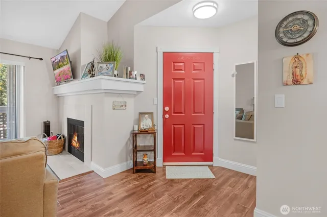 an entryway with a workspace and a window