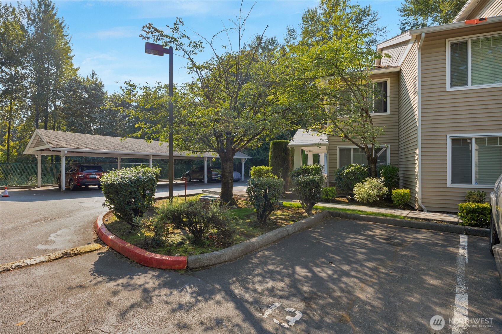 15300 112th Avenue Northeast, Unit A304 Bothell, WA 98011 - Photo 26 of 28 a view of a house with backyard and sitting area