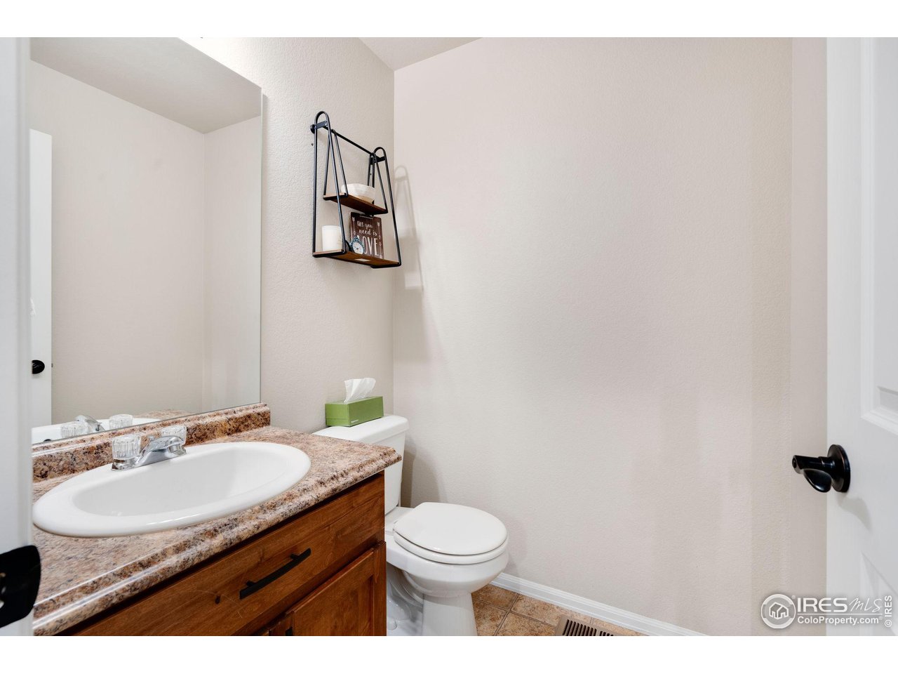 7334 23rd St Road Greeley, CO 80634 - Photo 14 of 31 a bathroom with a granite countertop sink toilet and mirror