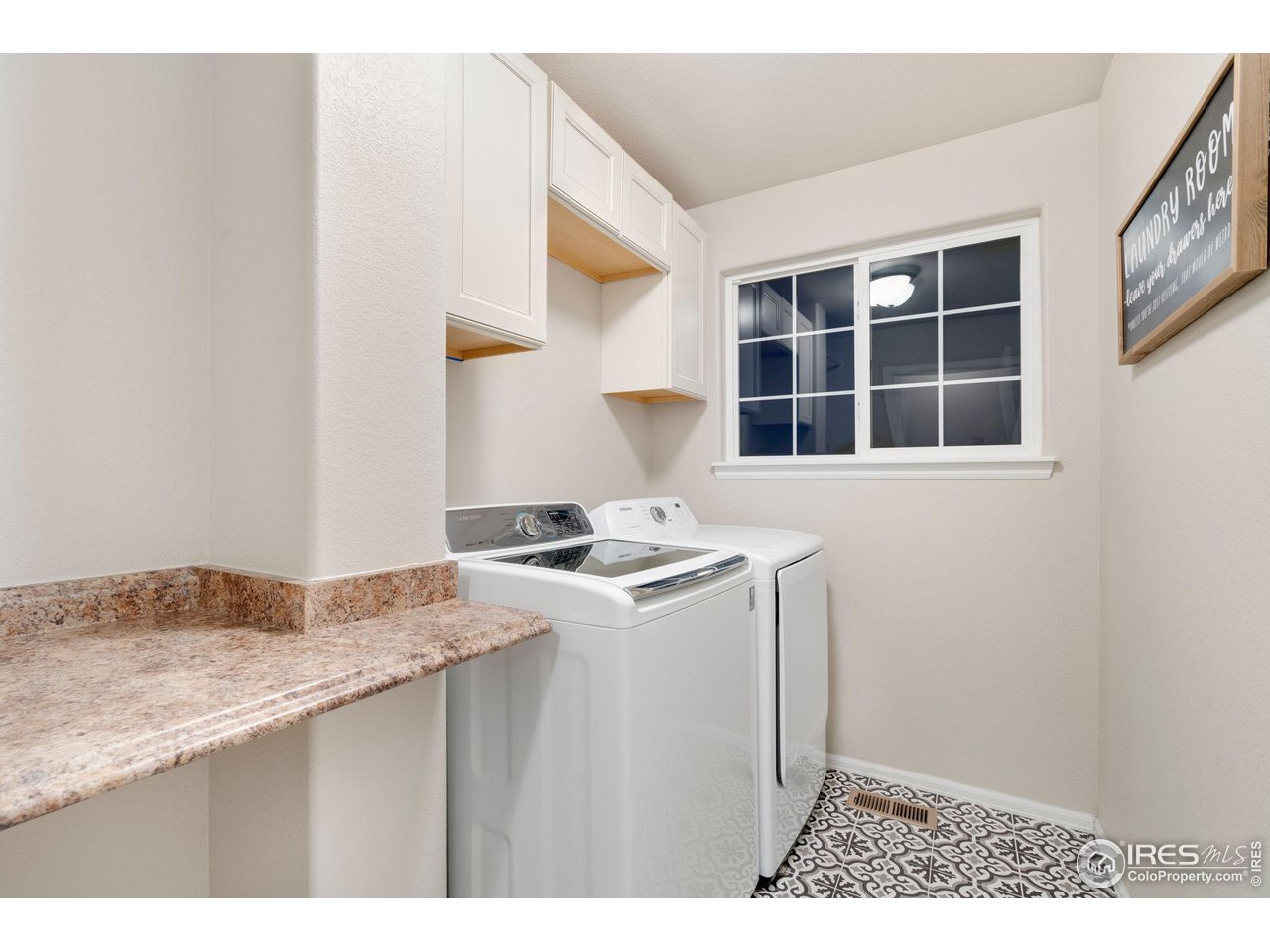7334 23rd St Road Greeley, CO 80634 - Photo 15 of 31 a kitchen with a stove and a refrigerator