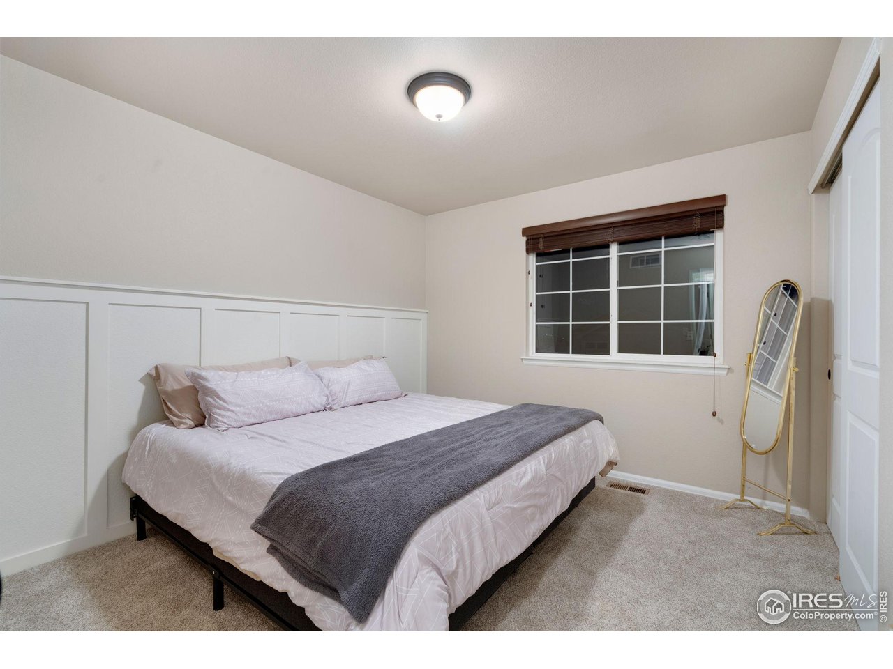 7334 23rd St Road Greeley, CO 80634 - Photo 20 of 31 a bedroom with a bed and a window