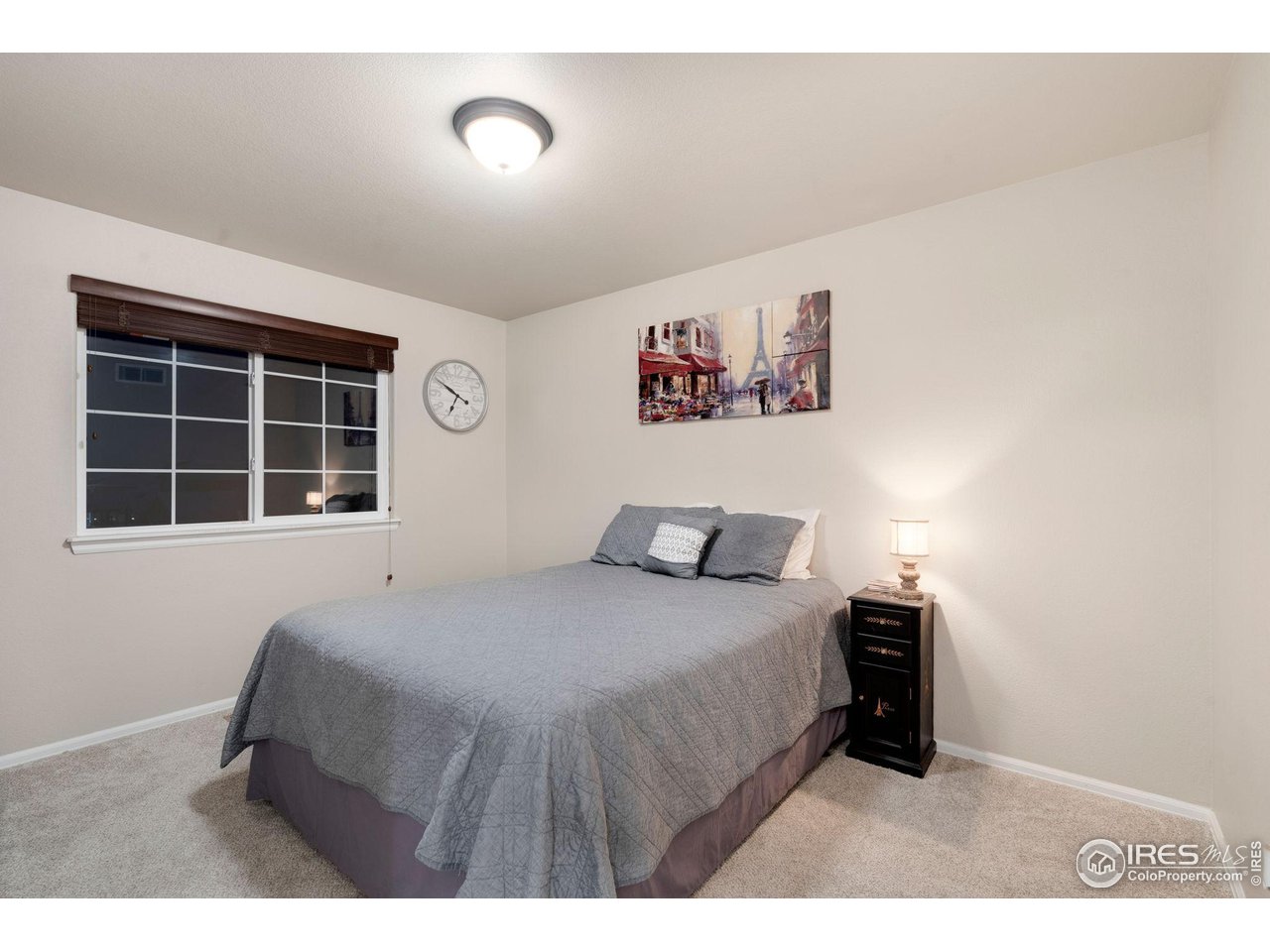 7334 23rd St Road Greeley, CO 80634 - Photo 22 of 31 a bedroom with a bed and a window