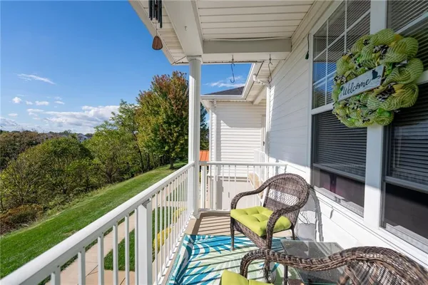 a view of a balcony with chairs