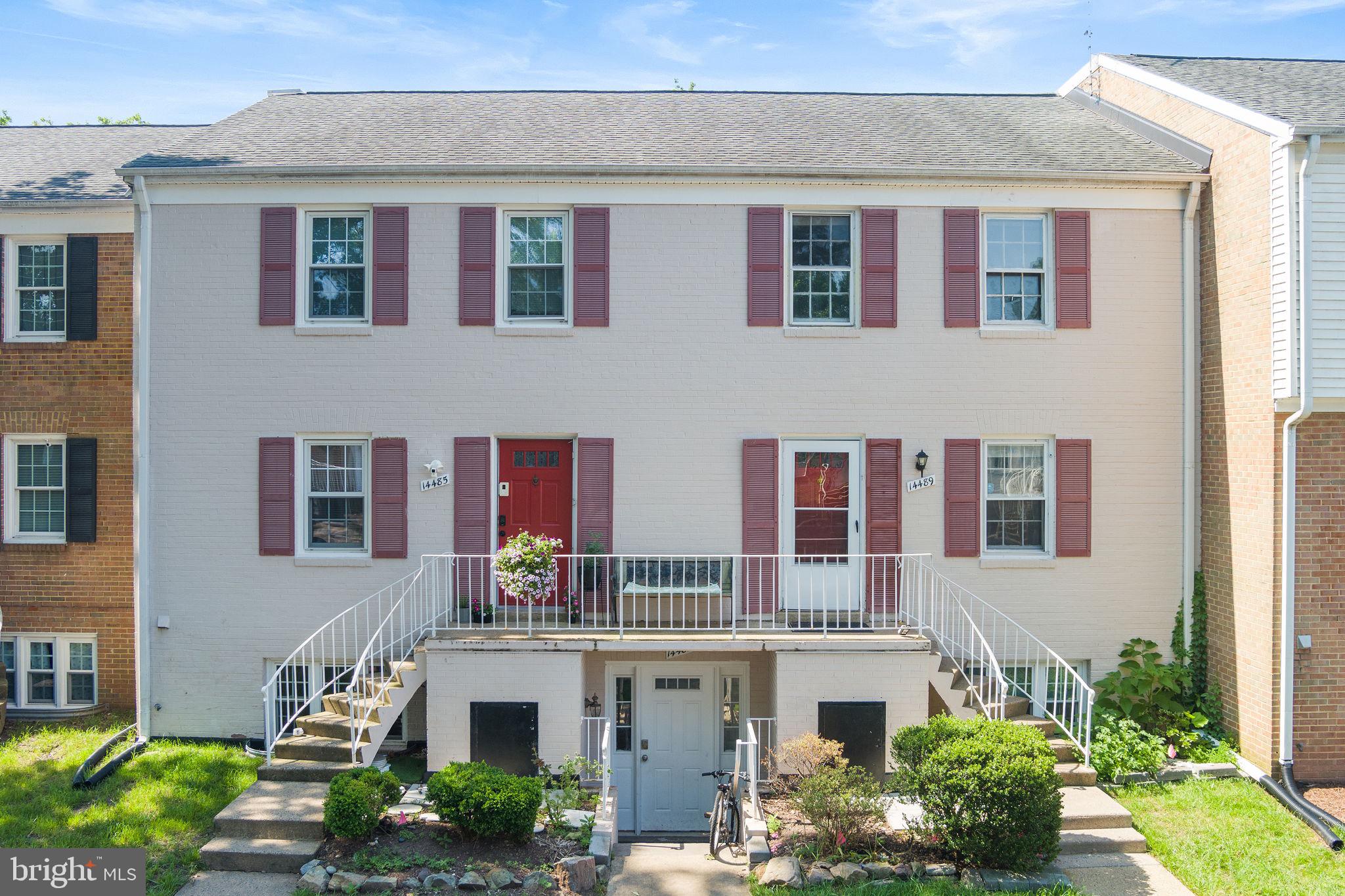 14489 Golden Oak Road Centreville, VA 20121 - Photo 1 of 27 a front view of residential houses with yard